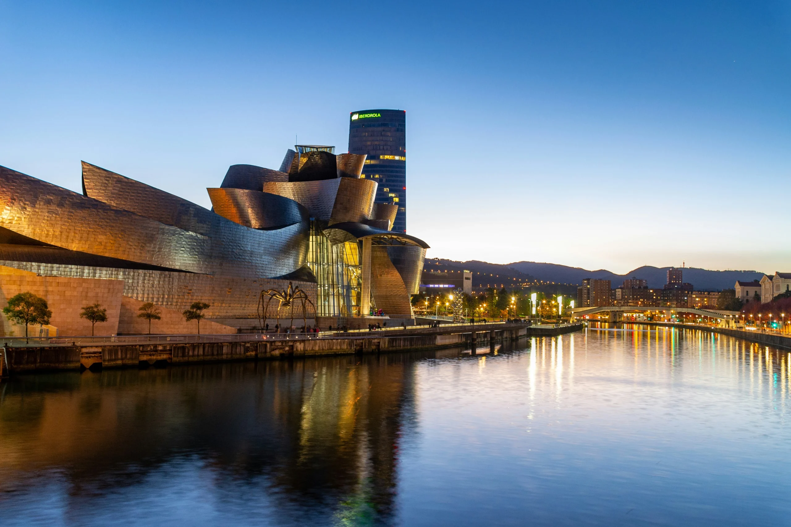 Guggenheim Museum Bilbao at dusk with river reflection, Basque Country
